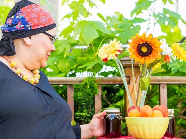 Hispanic Woman Enjoys Evening Snack Outside Stock Picture