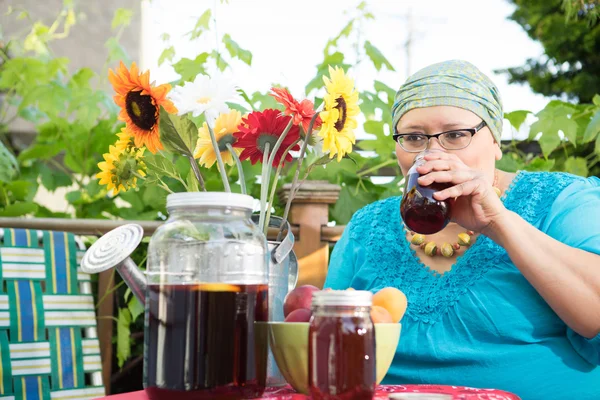 Woman Sips Sweet Tea Stock Picture