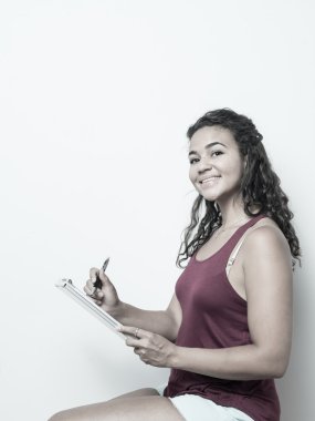 College Age Student Taking Notes