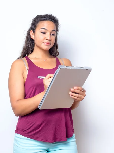 College Age Student Taking Notes — Stockfoto