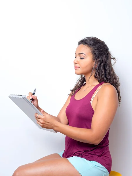 College Age Student Taking Notes — ストック写真