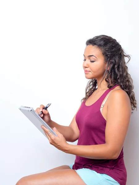 College Age Student Taking Notes — Stock fotografie