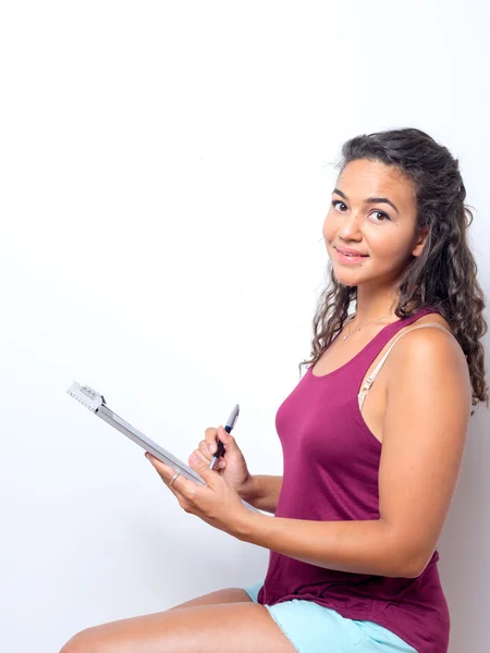 College Age Student Taking Notes — Stok fotoğraf