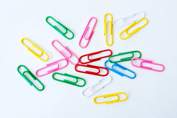 Variety of colorful paper clips on white background — Stock Photo, Image