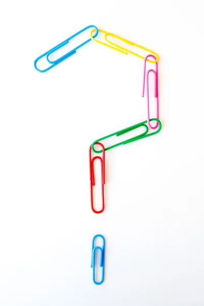 Variety of colorful paper clips on white background : question mark shape — Stock Photo, Image