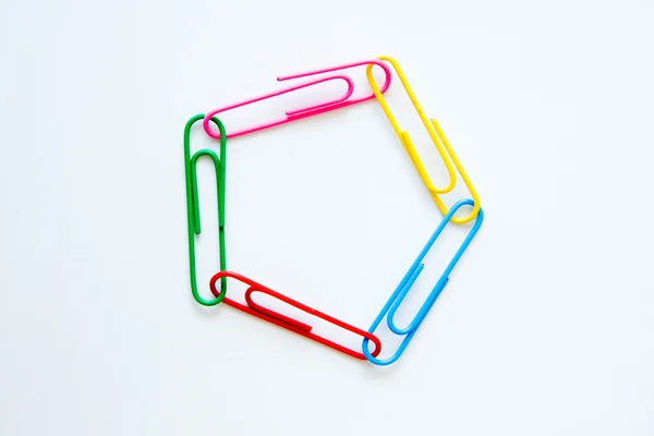 Variety of colorful paper clips on white background — Stock Photo, Image