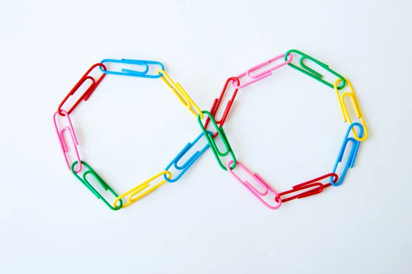 Variety of colorful paper clips on white background — Stock Photo, Image