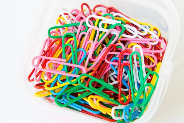 Variety of colorful paper clips on white background — Stock Photo, Image