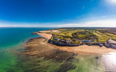 Drone aerial view of the beach and white cliffs on sunny day, Margate, England, UK clipart
