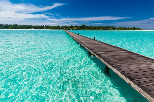 Wooden long jetty over lagoon — Stock Photo, Image