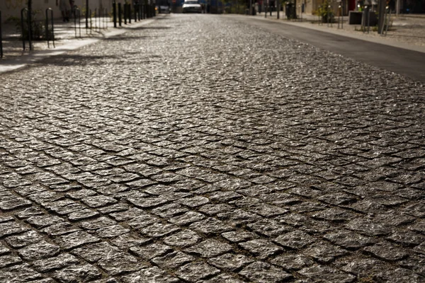 Grey cobblestone road in the night. Warsaw, Old Town. — Stock Photo, Image