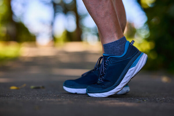 close-up on the feet of an athlete ready to run.