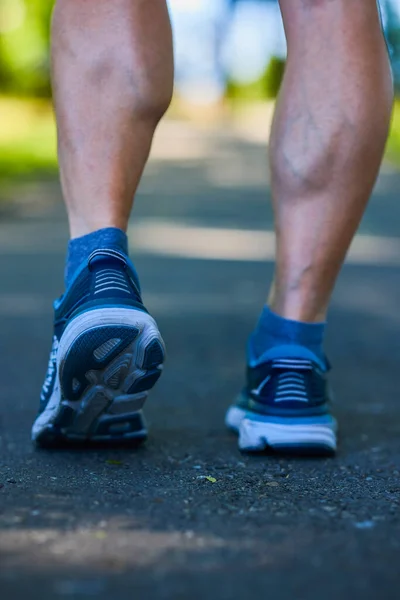 close-up on the feet of an athlete ready to run.