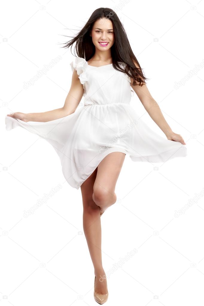 Beautiful woman in white dress on white
