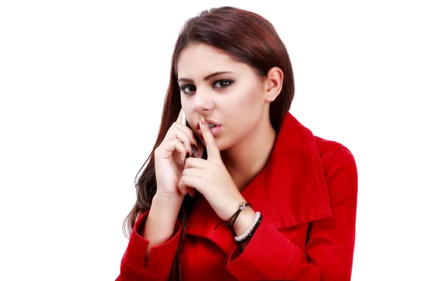 Young business woman making hush gesture during phone call — Stock Photo, Image