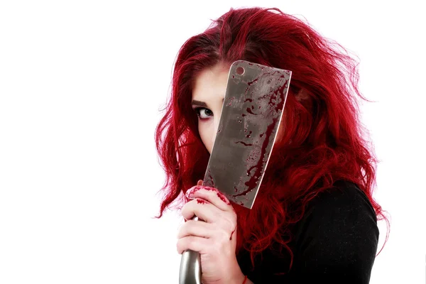 Redhead woman with a bloody hatchet in hand — Stock Photo, Image