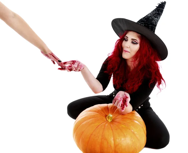 Redhead witch reaches a hand full of blood — Stock Photo, Image