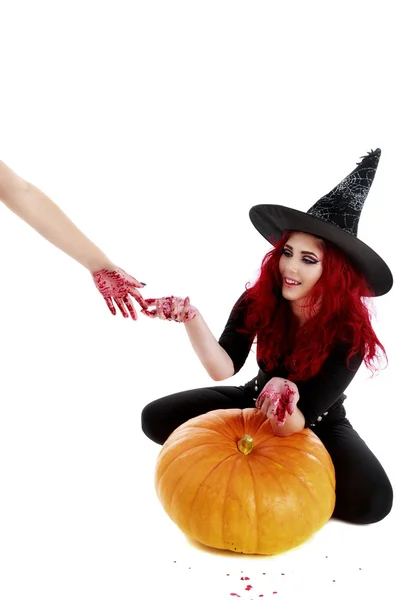 Redhead witch reaches a hand full of blood — Stock Photo, Image