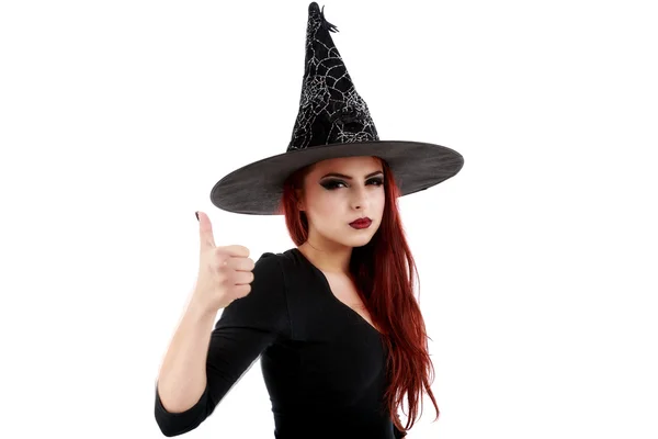 Portrait of young witch shows gesture "OK" over white background — Stock Photo, Image