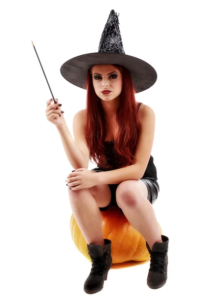 Portrait of a charming red-haired witch holding pumpkin . Hallow — Stock Photo, Image