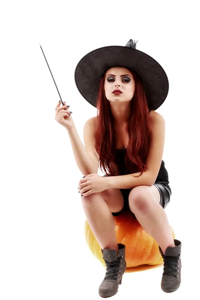 Portrait of a charming red-haired witch holding pumpkin . Hallow — Stock Photo, Image