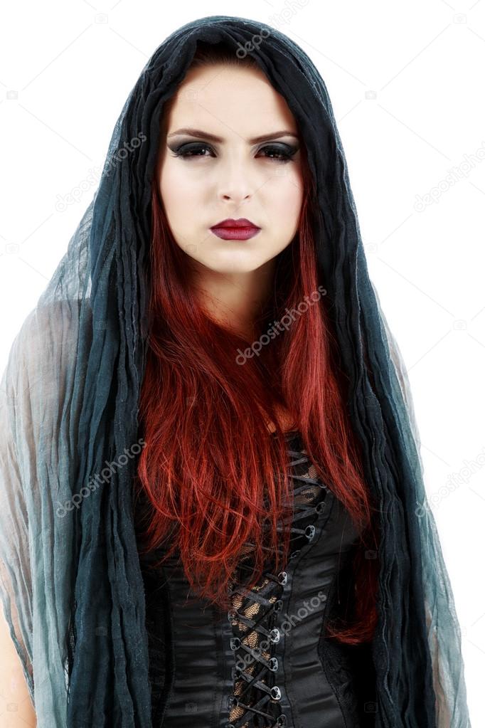 pretty young redhead witch, isolated against white background