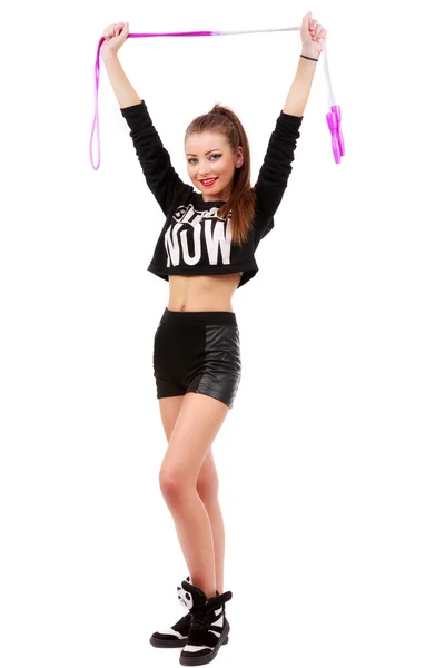 Attractive sporty woman posing holding a skipping rope on white — Stock Photo, Image