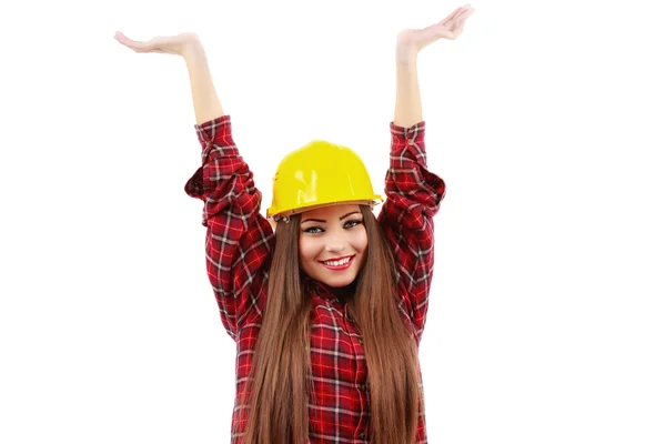 Young woman worker in red shirt and yellow helmet with raised ha — Stock Photo, Image