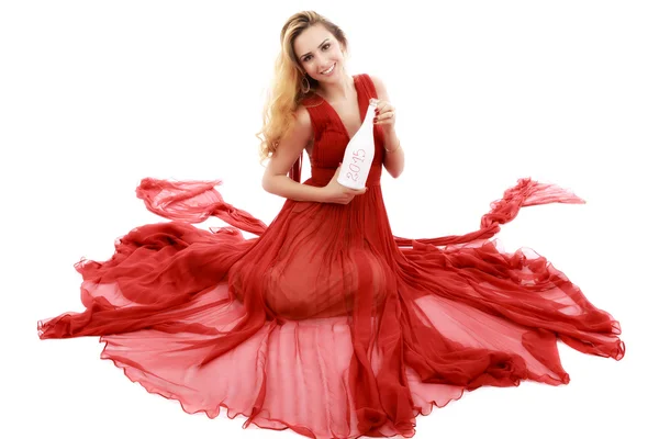 Mooie elegante vrouw in rode jurk met een glas champagne c — Stockfoto
