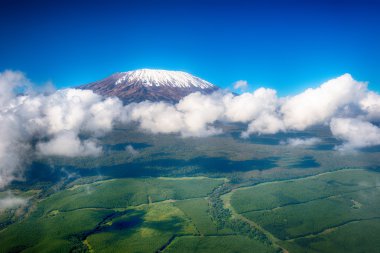 Aerial image of Mount Kilimanjaro, Africa's highest mountain, wi clipart