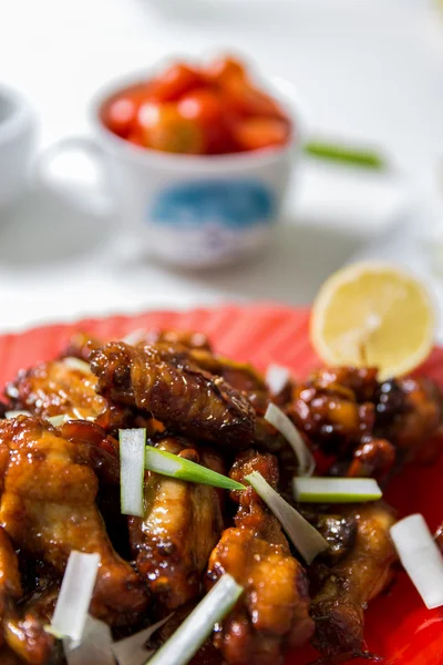 Closeup of caramelized asian chicken wings with selective focus — Stock Photo, Image