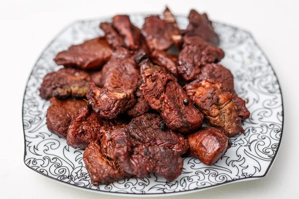 Plate with slices of beef meat well done — Stock Photo, Image