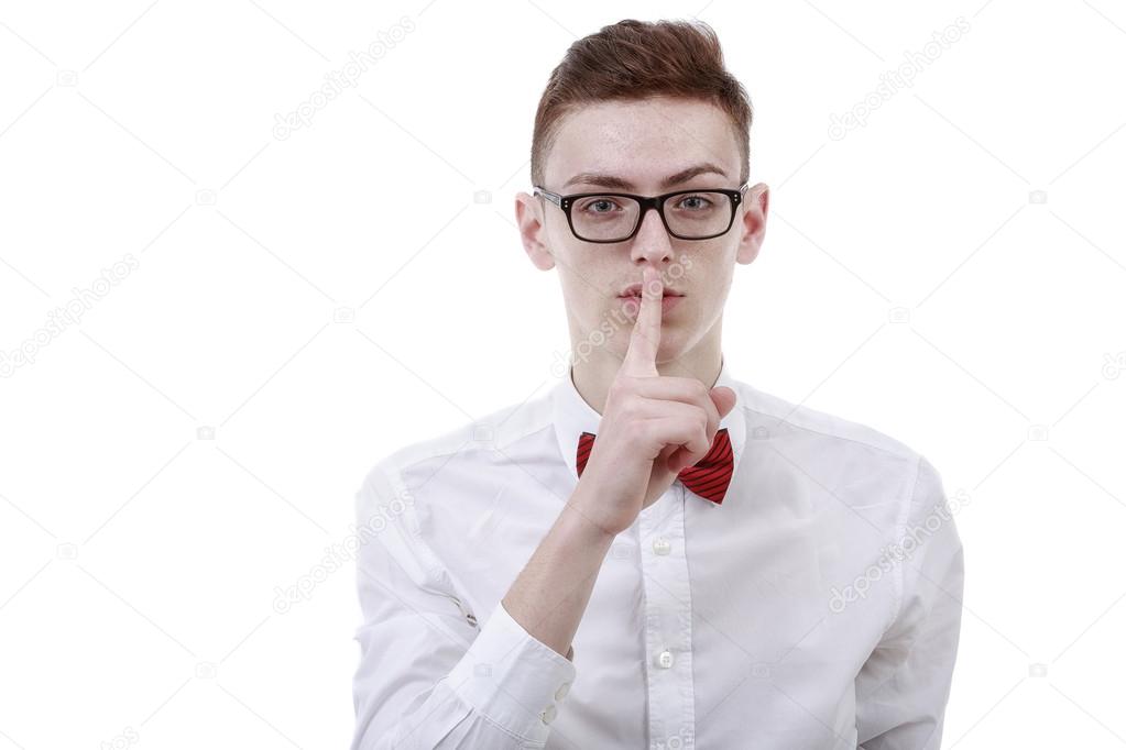 young business man showing silence gesture on white background