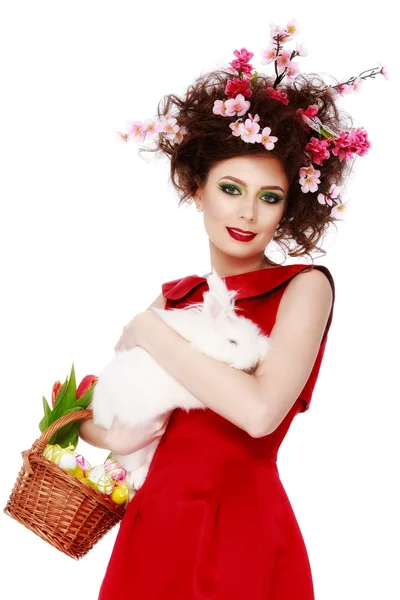 Woman with a bunny, eggs and flowers spring easter concept — Stock Photo, Image