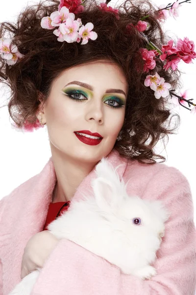 Woman with a bunny, eggs and flowers spring easter concept — Stock Photo, Image