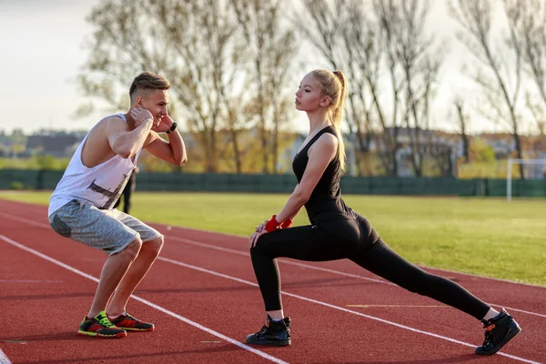 A beautiful young couple resting after running