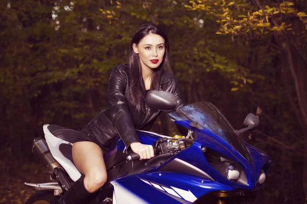 Beautiful Biker girl on a motorcycle — Stock Photo, Image