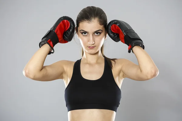 Sport young woman boxing gloves, face of fitness girl studio sho — Stock Photo, Image