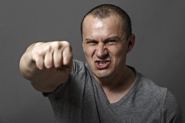 angry man shows his fist