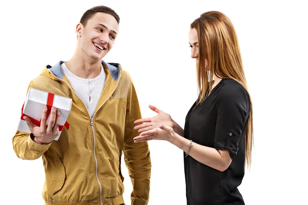 Young man gives gift, valentines day theme — Stock Photo, Image