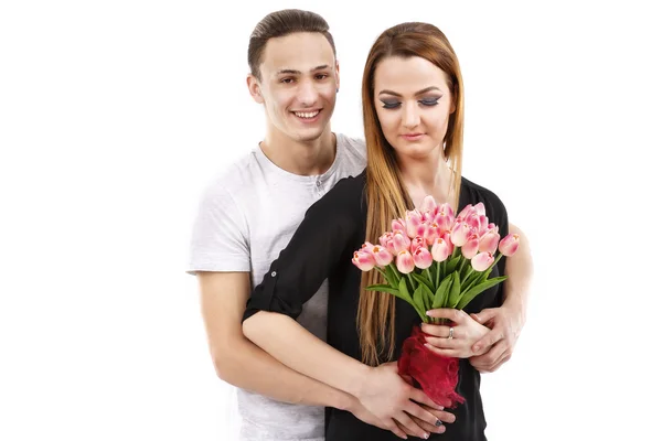 Happy couple with a bouquet of tulips, valentines day theme — Stock Photo, Image