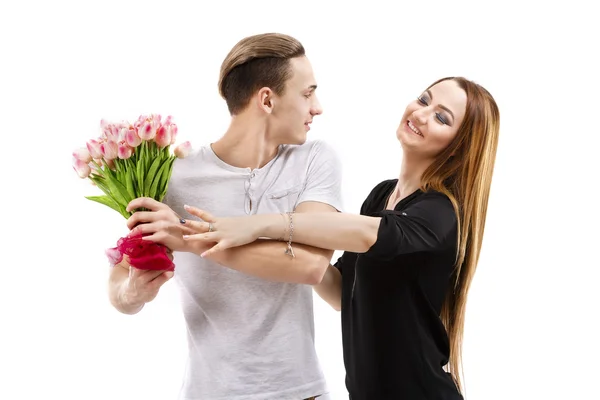 Happy couple with a bouquet of tulips, valentines day theme — Stock Photo, Image