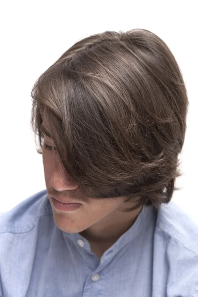 Portrait of teen boy with long surfer haircut — Stock Photo, Image