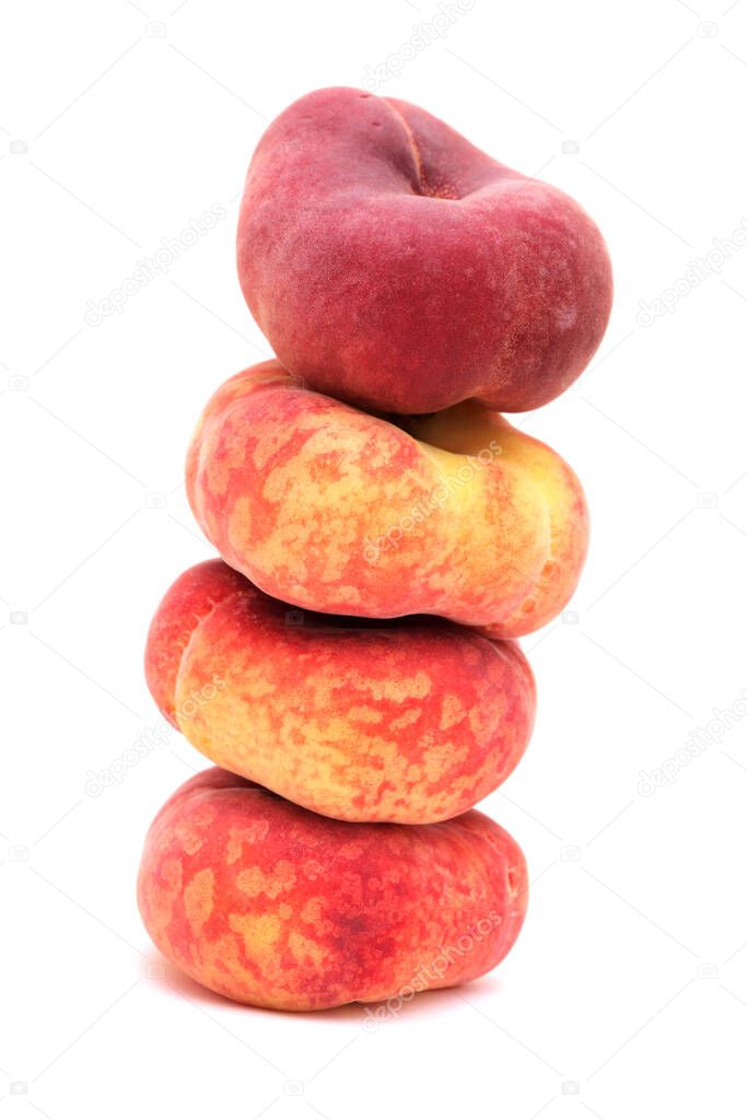 Large yellow and red flat peach fruit isolated on white background