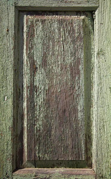 Old peeling paint over wooden panel — Stock Photo, Image