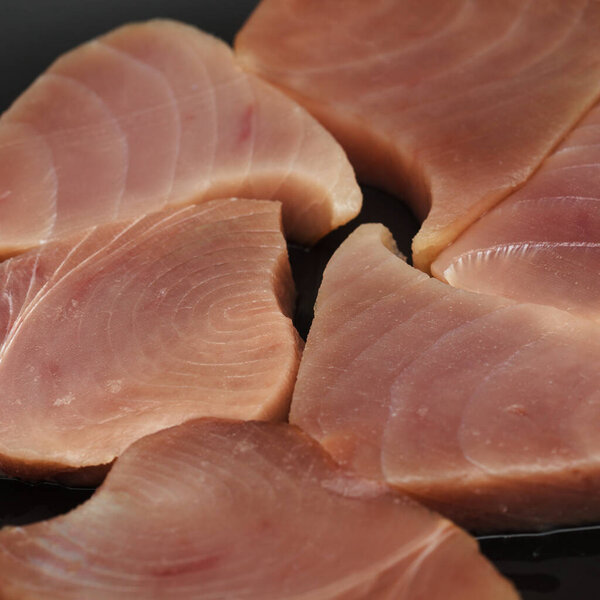 Raw uncooked thick Yellowfin tuna steaks 
