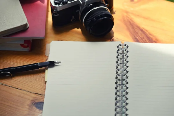 Photographer Work Station Digital Camera Notebook Pen — Stock fotografie