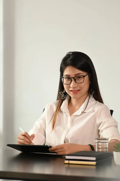 Portrait Smiling Pretty Young Businesswoman Glasses Sitting Workplace Office — Stock Photo, Image