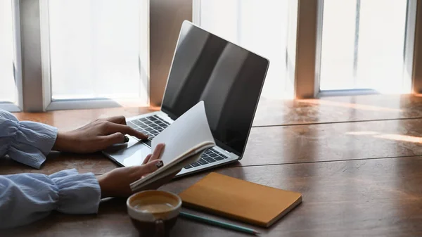 Side View College Student Reading Book Find Information Using Laptop — Stok fotoğraf