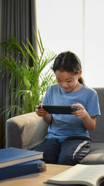 Portrait Young Asian Girl Playing Games Sitting Sofa Living Room — Stok fotoğraf